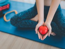 Defocused,Of,Happy,Sport,Woman,Holding,Red,Heart,In,Hand.